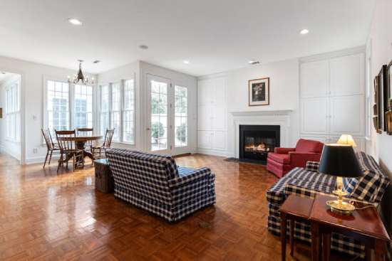 A living room with a beautiful and clean hardwood floor